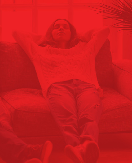 woman relaxing on her couch